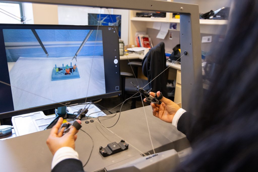 person manipulating biomedical device remotely