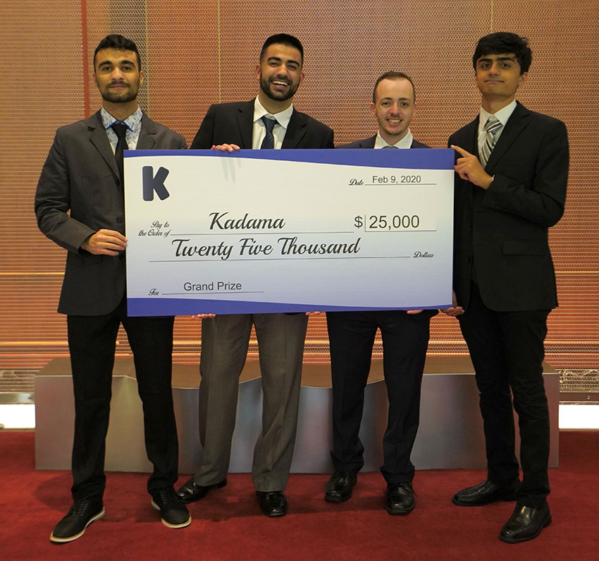 Kadama team members holding large $25,000 check