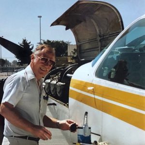 A man standing next to an airplane