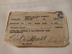 An old, crumpled pilot's license