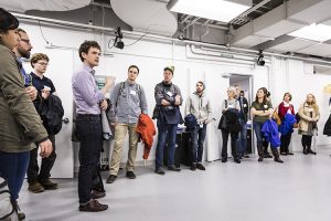 Sam Burden talking to a group of people in the AMP Lab