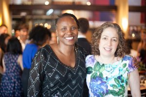 Sonya Cunningham and Eve Riskin at a social gathering