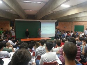 Rico Malvar speaking in a classroom in front of students