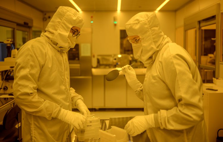 Researchers in clean room