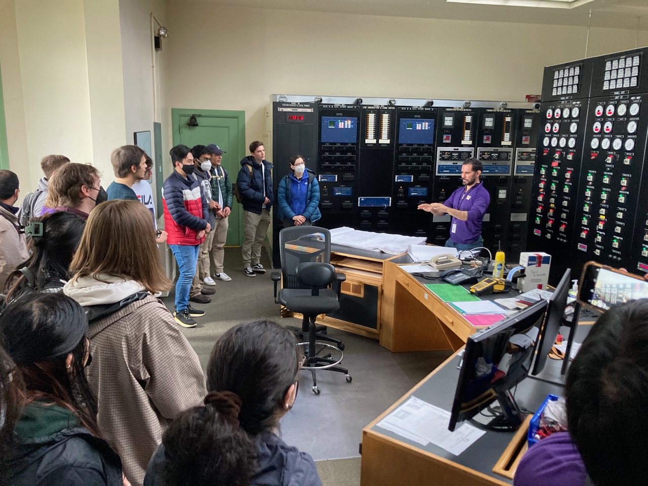 Group of students standing in the control room of Cushman Hydro