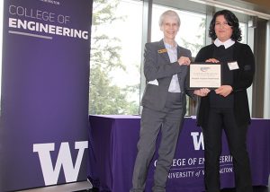 UW ECE Assistant Professor Azadeh Yazdan receives her award from Dean Nancy Allbritton on stage at the CoE award ceremony