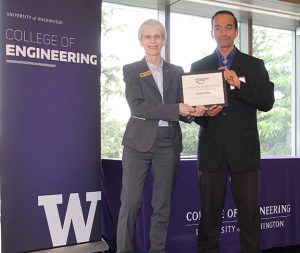Dean Nancy Allbritton and Rajesh Rao on stage at the CoE award ceremony