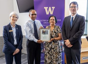 Ganesh and Hema Moorthy being presented with a plaque of appreciation from Dean Allbritton and UW ECE Chair Eric Klavins