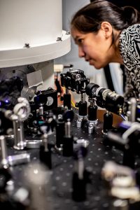 Professor Kai-Mei Fu working on a device in the lab