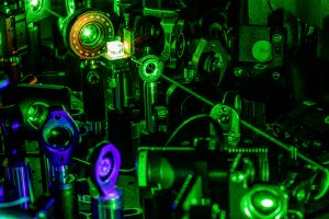 Close up of a crystal being targeted by a laser in Fu's lab