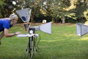 Zerina Kapetanovic working on test equipment in Sylvan Grove on the UW campus