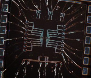 An up-close, colorful image of chip circuitry