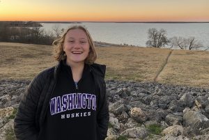 Margot Adam standing in front of a lake outside of Austin, Texas