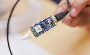 A close-up view of a microcontroller from the Arduino Tiny Machine Learning Kit