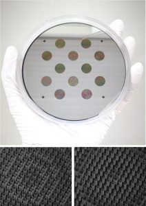 A hand wearing a white glove holding a fabricated disk containing several small discs, which contain metaoptics. Below this photo are two grayscale photos of nanopillars.