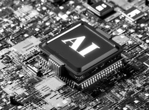 A black-and-white photo of a computer chip with the letters "AI" stamped on it, mounted to a motherboard