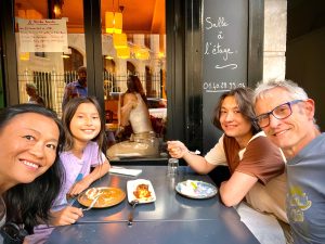 Tran with her husband, Chris, and children, Maila and Thoren, in Paris, France in 2022.