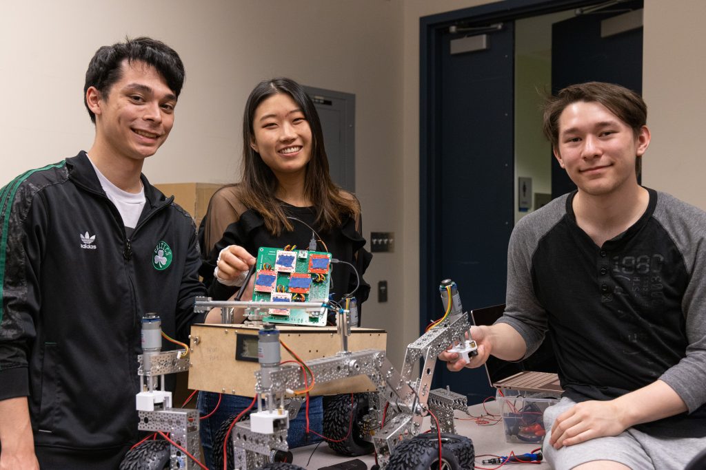 ENGINE 2002 team working on their robotics project