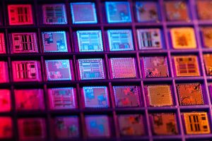 A colorful photo of microchips, arranged in a grid.