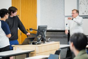 UW ECE Professor Chris Rudell in the classroom with students